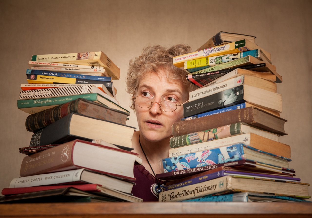 Emma Decent with books at either side of her