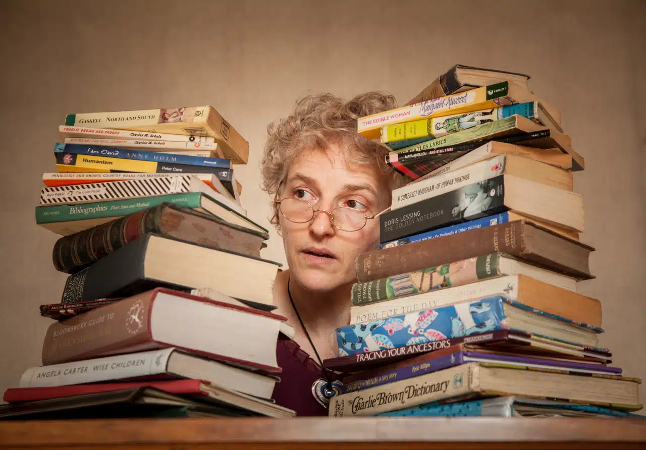 Emma Decent with books at either side of her