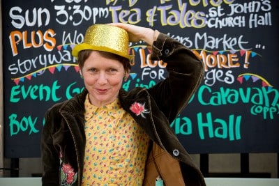 Urusla Holden Gill in gold hat