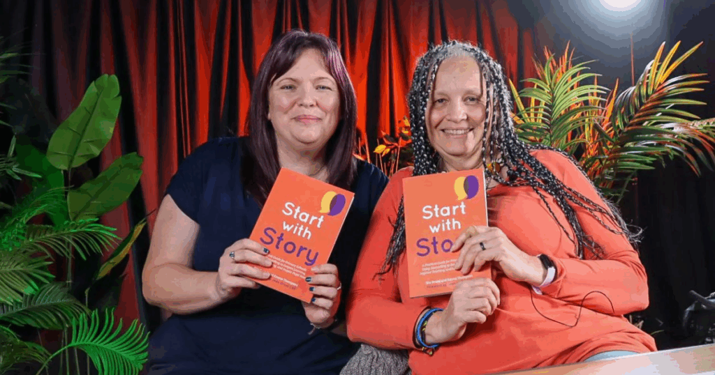 Start With Story - Emma and Sita smile, holding copies of the book