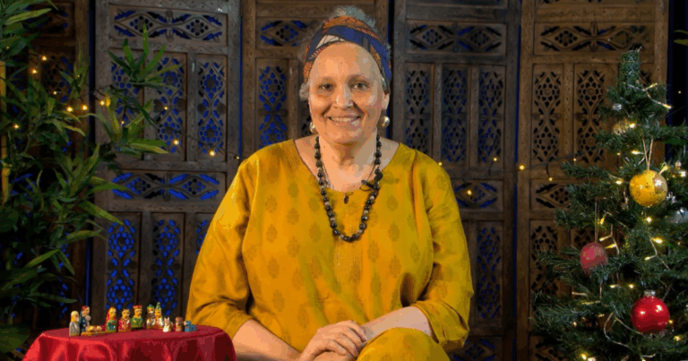 A still from the Free Nativity Story Resource video, with storyteller Sita Brand smiling.